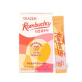 TEAZEN Kombucha Mango & Guava — Caja naranja y rosa de kombucha y sobre individual.