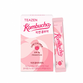 TEAZEN Kombucha Peach — Caja rosa claro de kombucha y sobre individual con ilustraciones de melocotones.