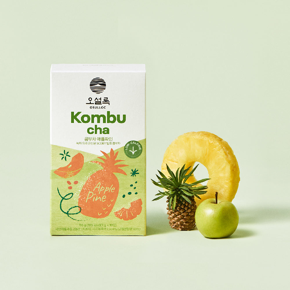 OSULLOC Kombucha Apple Pine — Apple Pine box beside pineapple and a green apple.