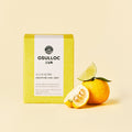 OSULLOC Signature Earl Grey — Yellow box beside whole and cut citrus.