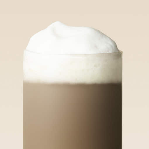OSULLOC Jeju Hojicha Milk Tea — Close-up of a brown milk tea drink topped with white foam.