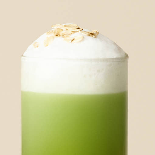 OSULLOC Jeju Matcha Oat Blend — Green matcha drink topped with white foam and oat flakes.