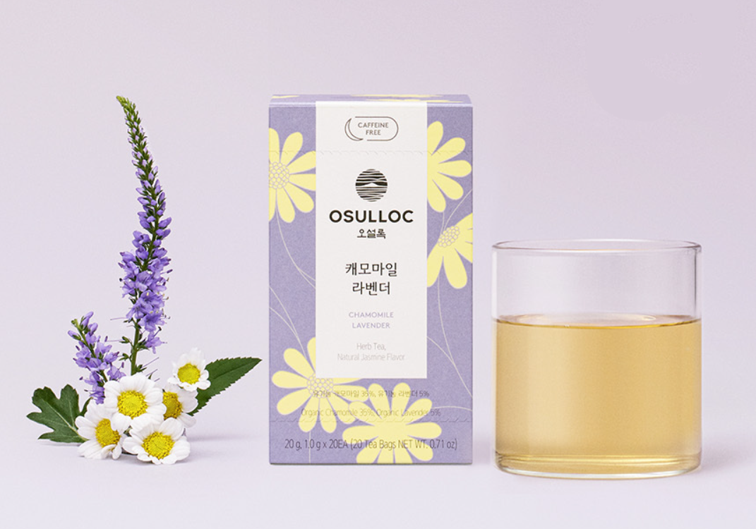 OSULLOC Herbal Tea Life Set — Purple chamomile and lavender box beside flowers and a glass of infusion.