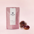 OSULLOC Marron Cream Black Tea — Bolsa rosa apagado junto a una castaña y su erizo.