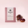 OSULLOC Marron Cream Black Tea — Caja rosa apagado junto a una castaña y su erizo.