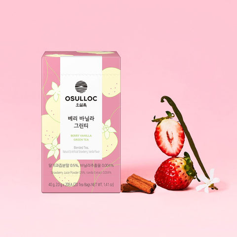 OSULLOC Berry Vanilla Green Tea — Pink box beside strawberries, a vanilla pod and brown spice pieces.
