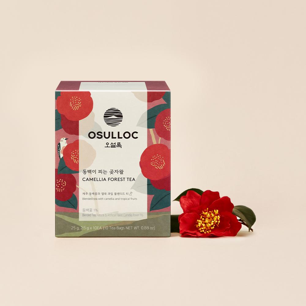 OSULLOC Camellia Forest Tea — Red floral Camellia Forest box beside a red camellia flower.