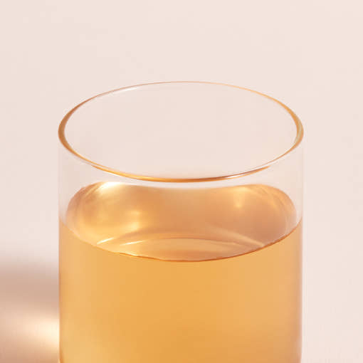 OSULLOC Cherry Blossom Blended Tea — Amber tea in a clear glass.