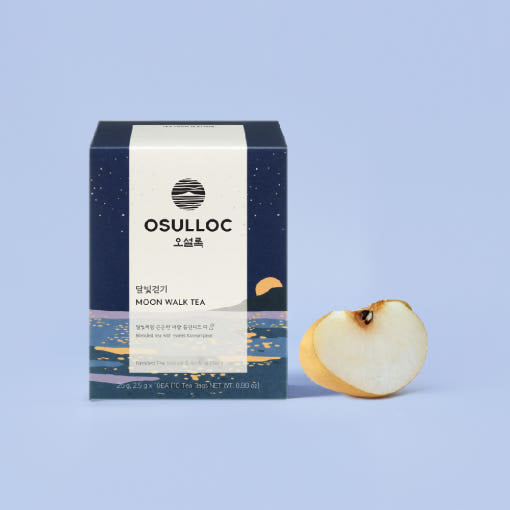 OSULLOC Moon Walk Tea — Dark blue Moon Walk box beside a cut pear.