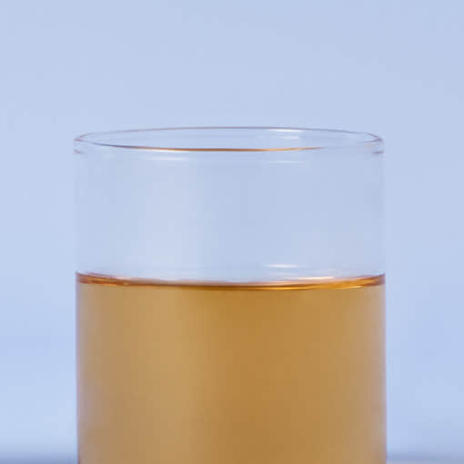 OSULLOC Moon Walk Tea — Amber tea in a clear glass against a blue background.