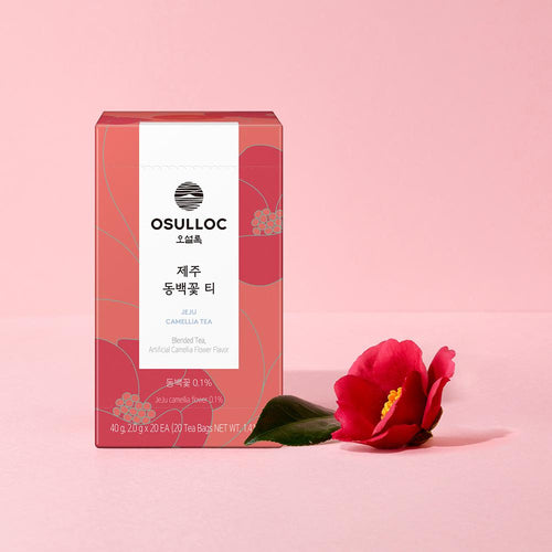 OSULLOC Jeju Camellia Tea — Red box beside a red camellia flower and a green leaf.