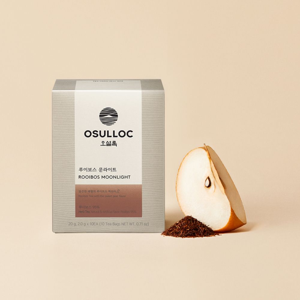 OSULLOC Rooibos Moonlight — Grey Rooibos Moonlight box beside a pear wedge and loose rooibos.