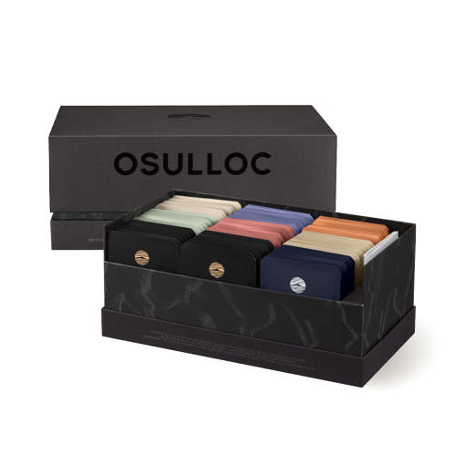 OSULLOC Tea Edition Heritage Gift Set — Cofre negro de regalo Heritage abierto con filas de sobres de té de colores.