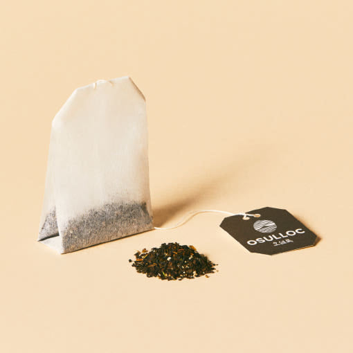 OSULLOC Tangerine Blossom Tea — Paper tea bag, loose tea and black OSULLOC tag.