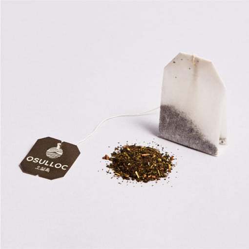 OSULLOC Peach Black Tea — Paper tea bag and loose blend on a pale background.