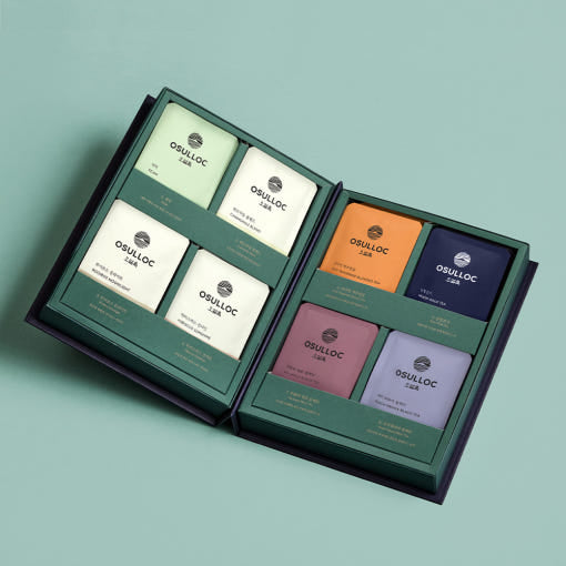 OSULLOC Masterblend Tea Collection — Angled overhead view of the open gift box and its tea packets.