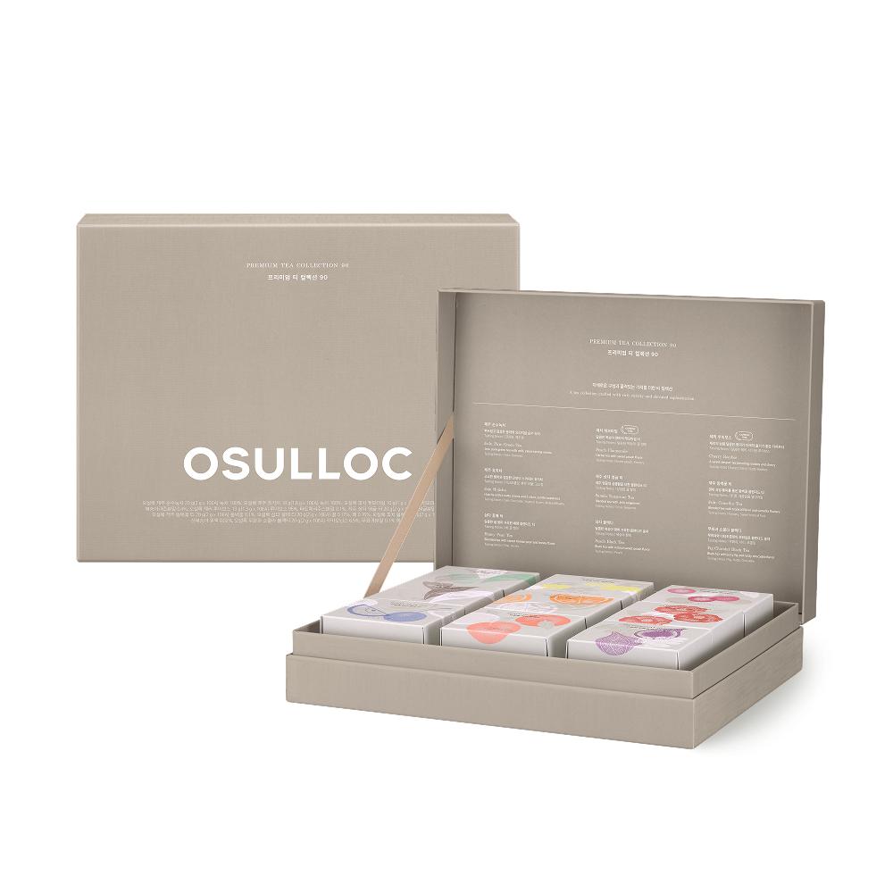 OSULLOC Premium Tea Collection 90 — Open grey gift box holding small illustrated tea cartons, beside a matching closed grey box.