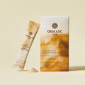 OSULLOC Samdayeon Original Milk Tea — Carton, sachet and a small pile of powder on a pale background.