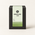 Té verde Sejak de OSULLOC, 10 pirámides en una caja negra sobre fondo marfil.