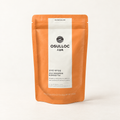 OSULLOC Jeju Tangerine Blended Tea, 20 pyramid bags in an orange 50 g pouch on an ivory background.
